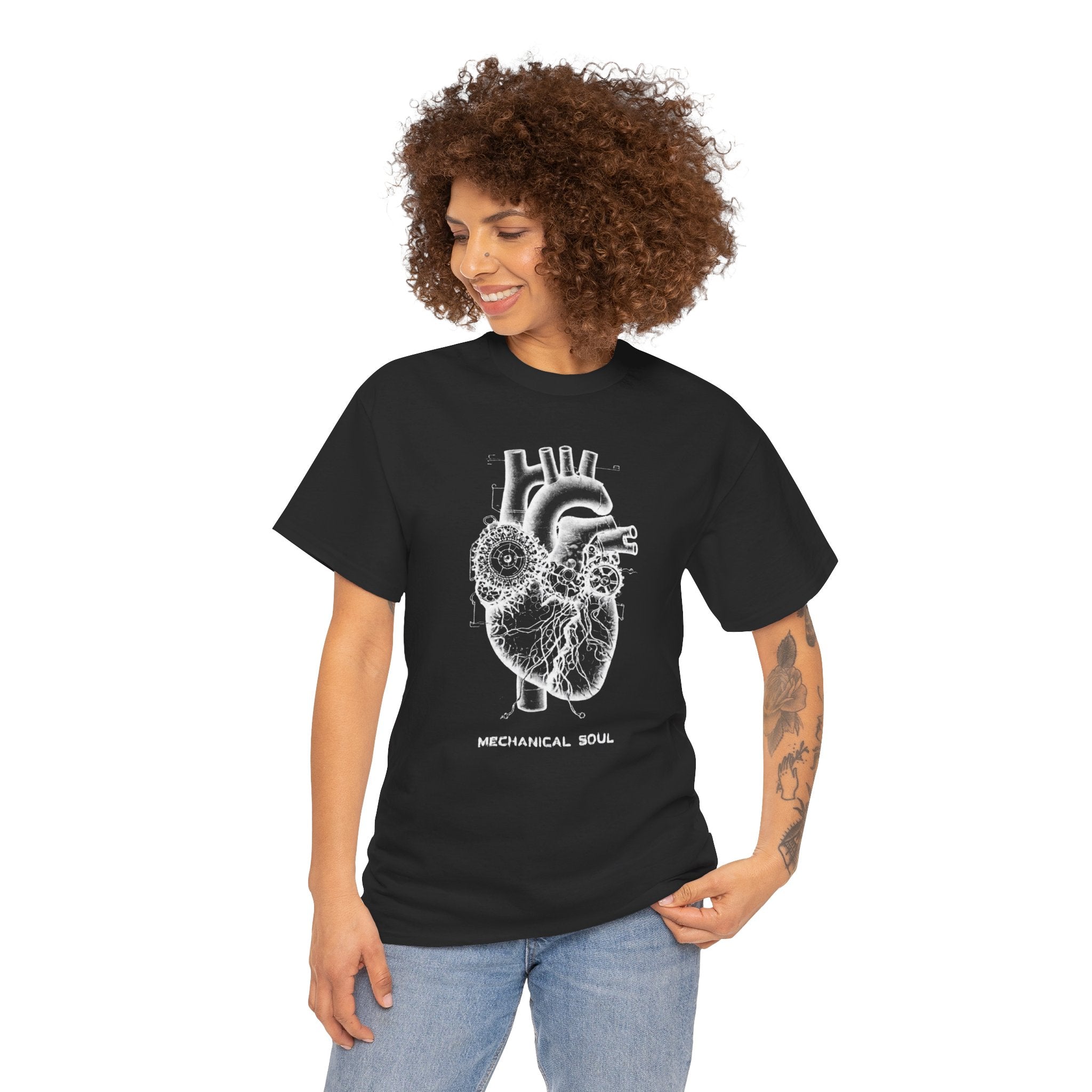 Woman wearing a black t-shirt with a mechanical heart design on a white background