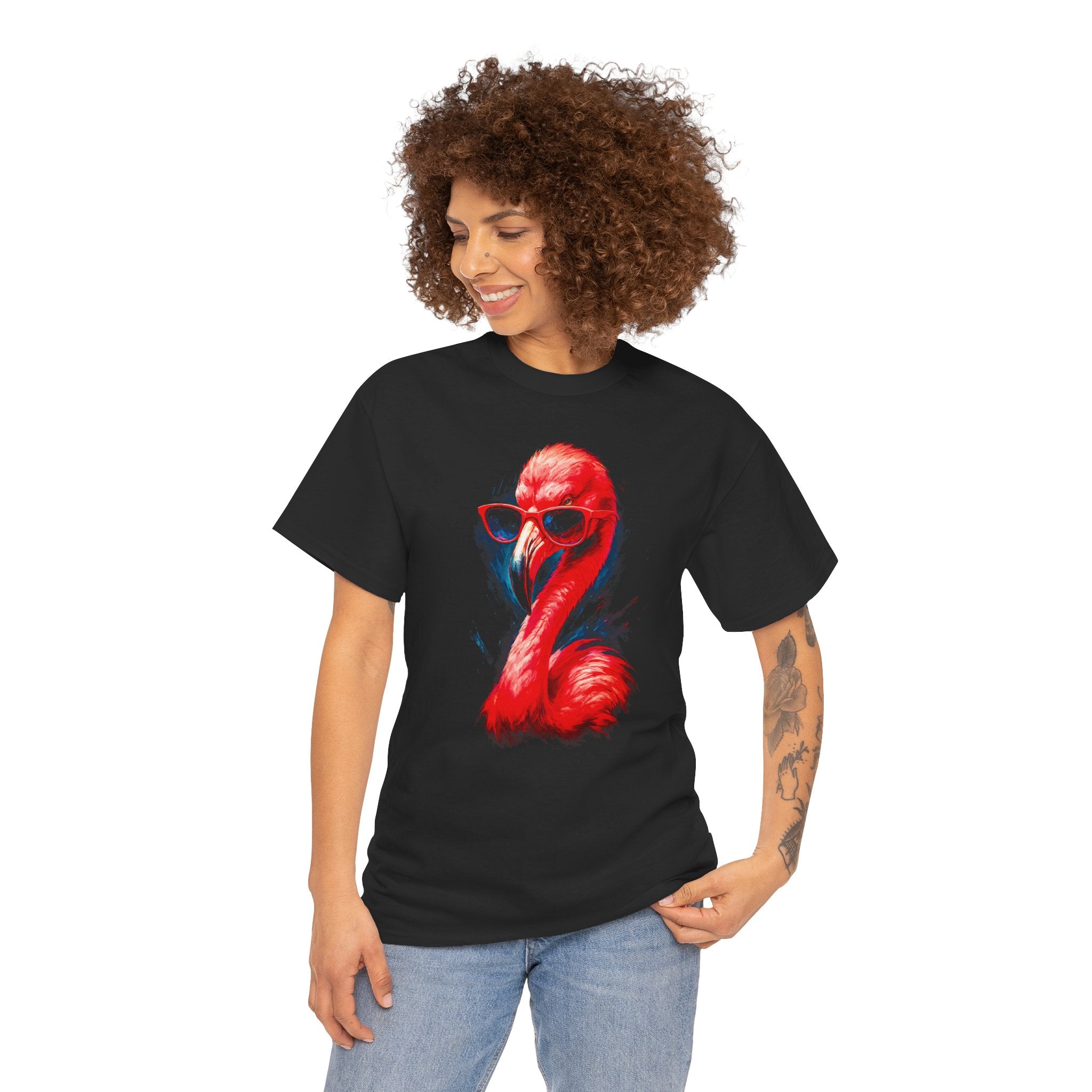 Person wearing a black t-shirt with a red flamingo graphic on a white background